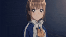 a girl in a blue jacket with the letter t on the front