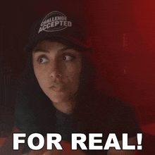 a woman is wearing a hat that says challenge accepted