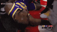 a basketball player is laying on the floor with the words mlgnba at the bottom
