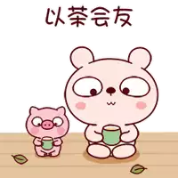 a bear and a pig are sitting at a table holding cups