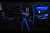 a man and a woman are dancing in a dark room with a sign on the wall that says " rolling stones "