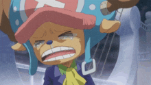 tony tony chopper from one piece is crying and wearing a blue hat with a cross on it