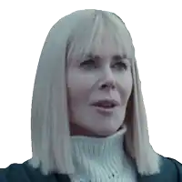 a woman with blonde hair and a white turtleneck sweater