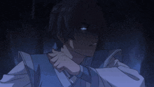 a boy with blue eyes is sticking out his tongue
