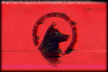 a red background with a black dog in a circle with the letters tiger on it