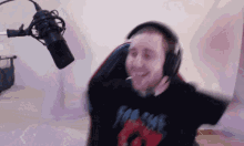 a man wearing headphones and a shirt that says ' for sale ' on it