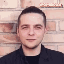 a man is standing in front of a brick wall with a wombo.ai logo on the bottom right corner .