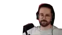 a man wearing headphones and a white shirt is pointing at something