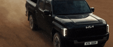 a black truck with a license plate that says ktk 1029