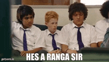 a group of boys are sitting on a couch with the caption hes a ranga sir on the bottom