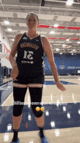 a female basketball player wearing a jersey with the number 16 on it