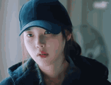 a close up of a woman wearing a baseball cap with the word firefly on the bottom