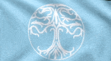 a tree in a circle is on a blue cloth