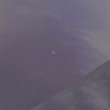 a person is flying through the air in front of a large square