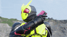 a man in a masked rider costume is holding a gun and says chắc là sẽ bay được đây !