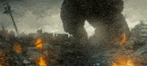 a large monster is standing in the middle of a destroyed city ..