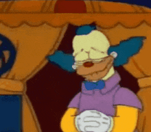 a cartoon clown is standing in front of a curtain
