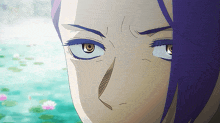 a close up of a person 's eyes with purple hair