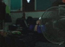 a person laying on a couch looking at a phone