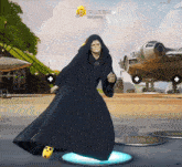a man in a black robe is dancing in a video game with a star behind him