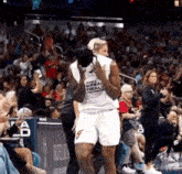 a basketball player wearing a shirt that says world breast health league on it