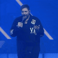 a man is wearing a jacket that says down but not out