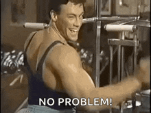 a man is smiling while using a machine in a gym and says `` no problem '' .