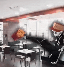 a person is standing in a restaurant with tables and chairs and a chicken being thrown in the air .