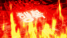 a red box with chinese writing on it is surrounded by flames