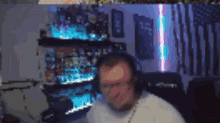 a blurry picture of a man wearing headphones and glasses