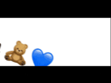 a teddy bear sits next to a blue heart and the word " posi "