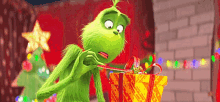 The Grinch Unwrapping Gift GIF - The Grinch Unwrapping Gift Gift GIFs