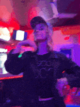 a woman wearing a hat and a black shirt that says doc