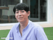 a man in a blue shirt with judleklak702 written on the bottom