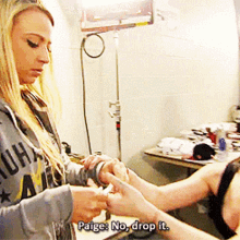 a woman in a hoodie that says paige on it