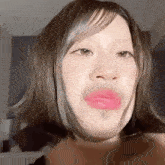 a close up of a woman making a funny face with her mouth open