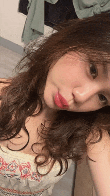 a woman is taking a picture of herself with her lips visible