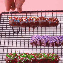 a row of chocolate covered treats with sprinkles on them
