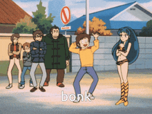a group of people are standing in front of a sign that says no entry