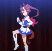 a girl dressed as a horse with a red tail is standing on one leg