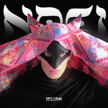 a woman wearing a colorful scarf and a black mask with the name elian on the bottom