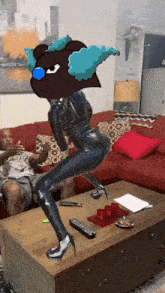 a man sits on a couch while a woman in a latex suit stands on a table