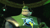 a green cartoon character with a lightning bolt on his chest stands in a dark room