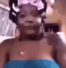 a woman wearing a mask is taking a selfie .
