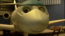 a cartoon airplane wearing a blue hat and mask