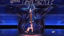 a man and a woman are doing a stunt on a stage with the words got talent behind them