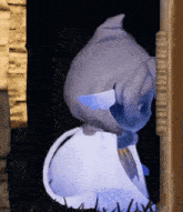 a drawing of a dolphin with a blue tail is on a wall