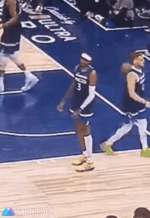 a basketball player wearing a number 10 jersey is walking on the court