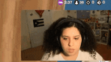 a woman wearing headphones with the time 2:37 on the bottom