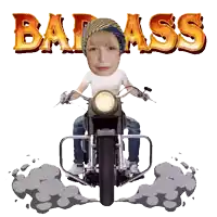 a young boy is riding a motorcycle with the word badass behind him